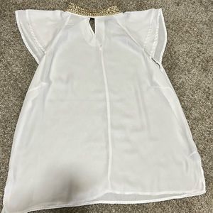 White shirt with gold and silver high neck collar